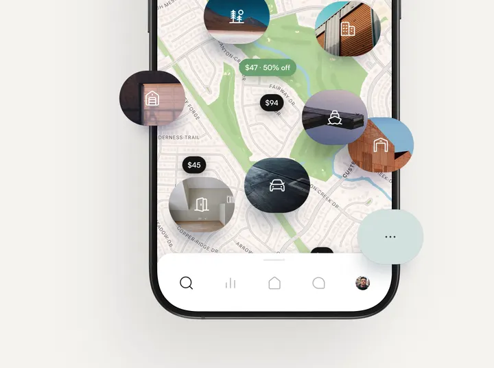The Garage Space app showing nearby spaces on a map, each with a photo and a nightly price